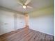 Spacious bedroom with natural light, wood floors, and ample closet space at 6604 Plyler Mill Rd, Monroe, NC 28112