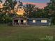 Charming single-story home features a stone porch, large yard, and beautiful sunset views at 6604 Plyler Mill Rd, Monroe, NC 28112