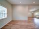 Spacious open-plan living room features neutral paint, and expansive windows at 6604 Plyler Mill Rd, Monroe, NC 28112