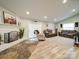 Spacious living room with a white brick fireplace and comfortable seating arrangements at 6604 Plyler Mill Rd, Monroe, NC 28112