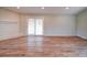 Bright living room featuring a brick fireplace and sliding glass doors at 6604 Plyler Mill Rd, Monroe, NC 28112