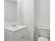 Half bathroom with white vanity, sink and toilet at 6640 Autumn Gate Ln, Charlotte, NC 28216