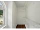 Walk-in closet with ample shelving and natural light from the window at 6640 Autumn Gate Ln, Charlotte, NC 28216