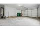 Garage with door and visible storage and organizational elements at 6640 Autumn Gate Ln, Charlotte, NC 28216