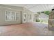 View of the covered patio with brick flooring and white ceiling at 6640 Autumn Gate Ln, Charlotte, NC 28216