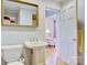 Vintage bathroom with period fixtures and a charming open doorway to a sunroom at 6664 Lake Shore Dr, Hickory, NC 28601