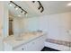 Bathroom featuring double sinks, tile countertops, and a built-in seat at 6664 Lake Shore Dr, Hickory, NC 28601