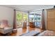 Bedroom featuring large windows with views of lake and trees at 6664 Lake Shore Dr, Hickory, NC 28601