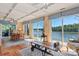 Elegant dining area featuring terracotta floors, coffered ceilings, and stunning lake views at 6664 Lake Shore Dr, Hickory, NC 28601