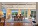 The dining room boasts terracotta tile floors, coffered ceilings, and panoramic lake views at 6664 Lake Shore Dr, Hickory, NC 28601
