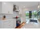 Contemporary kitchen with white cabinets, stainless steel range hood, and a blue oven with quartz countertops at 6664 Lake Shore Dr, Hickory, NC 28601