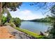Breathtaking lake view, framed by lush greenery and direct water access at 6664 Lake Shore Dr, Hickory, NC 28601
