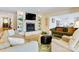 Cozy living room featuring a fireplace, built-in shelves, and comfortable seating at 6664 Lake Shore Dr, Hickory, NC 28601