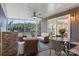 Covered porch with stone bar, seating, and views of the lake at 6664 Lake Shore Dr, Hickory, NC 28601