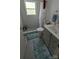 Cozy bathroom featuring a tiled shower and a modern vanity with updated fixtures at 718 Dogwood Ave, Lincolnton, NC 28092