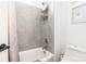 Clean bathroom with tiled shower/tub combination, toilet, and shelving to store shower products at 7728 Shalom Dr, Charlotte, NC 28216