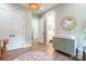 Spacious Bedroom with a leafy accent wall and a changing table with three drawers at 7728 Shalom Dr, Charlotte, NC 28216