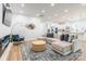 Open-concept living room with modern decor, comfortable seating, and open access to the kitchen at 7728 Shalom Dr, Charlotte, NC 28216