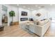 Bright living room featuring a modern electric fireplace, decor and comfortable furniture at 7728 Shalom Dr, Charlotte, NC 28216