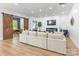 Spacious living room with modern fireplace, barn door, and comfortable sectional sofa at 7728 Shalom Dr, Charlotte, NC 28216