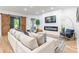 Comfortable living room with a large sectional sofa, electric fireplace, and stylish decor at 7728 Shalom Dr, Charlotte, NC 28216