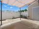 Inviting backyard with a concrete patio and white fence, ideal for privacy and outdoor enjoyment at 8037 Lynwood Sq, Waxhaw, NC 28173
