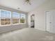Bright bedroom with plush carpeting and several windows at 8037 Lynwood Sq, Waxhaw, NC 28173