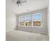 Bright bedroom with plush carpeting and a ceiling fan at 8037 Lynwood Sq, Waxhaw, NC 28173