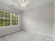 Bedroom features plush carpeting and a large window at 8037 Lynwood Sq, Waxhaw, NC 28173