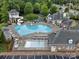 Aerial view of the community pool and clubhouse, offering resort-style amenities and a gathering place at 8037 Lynwood Sq, Waxhaw, NC 28173