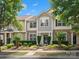 Charming townhome with stone accents, manicured landscaping, and inviting front entrance at 8037 Lynwood Sq, Waxhaw, NC 28173
