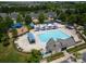 Aerial view of community pool area featuring a large pool, comfortable lounge chairs, and shade for a perfect summer experience at 8317 Dallas Bay Rd, Charlotte, NC 28278