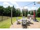 Outdoor patio with brick pavers, backyard kitchen and built-in grill perfect for entertaining or relaxing in the lush green space at 8317 Dallas Bay Rd, Charlotte, NC 28278