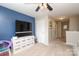 Hallway and playroom feature a flat screen television and toy organizer at 8317 Dallas Bay Rd, Charlotte, NC 28278