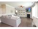Comfortable living room featuring a fireplace, mounted TV, and stylish decor at 8317 Dallas Bay Rd, Charlotte, NC 28278