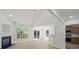 Open-concept living area featuring a fireplace, sliding glass doors, and modern finishes at 8347 Fox Swamp Rd, Charlotte, NC 28215