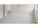 Bedroom featuring neutral walls, plush carpeting, base trim, and an entrance way at 908 Dairy Meadow Ct, Monroe, NC 28110