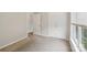 Bedroom featuring neutral walls, plush carpeting, closet with double doors, and a window at 908 Dairy Meadow Ct, Monroe, NC 28110
