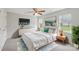 This staged bedroom features natural light, neutral tones and carpeted floors at 908 Dairy Meadow Ct, Monroe, NC 28110