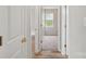 Hallway view into bedroom featuring carpet and a window at 908 Dairy Meadow Ct, Monroe, NC 28110