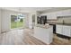 Modern kitchen with granite countertops, white cabinets, and stainless steel appliances at 908 Dairy Meadow Ct, Monroe, NC 28110