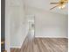 Bright living room featuring hardwood floors, neutral walls, and an open doorway to the backyard at 908 Dairy Meadow Ct, Monroe, NC 28110