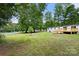 Expansive backyard with lush lawn and a new deck, perfect for outdoor enjoyment at 925 Crestland Dr, Clover, SC 29710