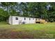 The home's exterior features a large backyard with a new deck, ideal for outdoor living at 925 Crestland Dr, Clover, SC 29710
