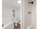 Bright bathroom featuring a soaking tub, toilet, window and a separate shower space at 925 Crestland Dr, Clover, SC 29710