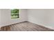 Bedroom with light hardwood floors and window view at 925 Crestland Dr, Clover, SC 29710
