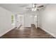 Bright bedroom featuring wood-look floors, an ensuite bathroom, and walk-in closet for ample storage at 925 Crestland Dr, Clover, SC 29710