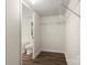 Walk-in closet with shelving and hardwood floors next to the bathroom at 925 Crestland Dr, Clover, SC 29710