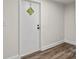 Charming white entry door with a diamond-shaped window that brings natural light into the room at 925 Crestland Dr, Clover, SC 29710