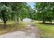 Home exterior from driveway showing large lot, grass and trees surrounding the house at 925 Crestland Dr, Clover, SC 29710